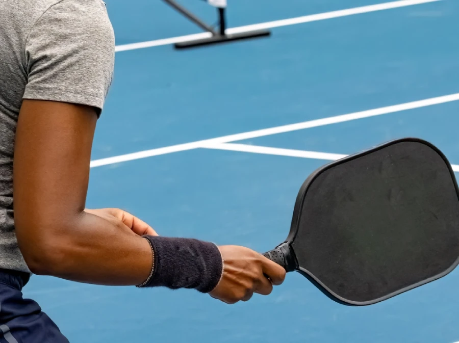 a pickleball player holding paddle